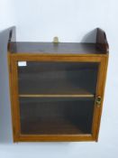 An Oak Wall Mounted Cupboard with Glazed Front, approx 49 x 26 x 80 cms.