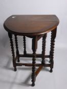 An Oak Drop Leaf Table on barley twist legs, approx 92 x 60 cms.