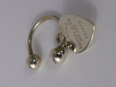 A  Solid Silver Tiffany Heart Shaped Key Ring in original felt sleeve.