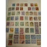 A Green Stamp Album containing stamps from Netherlands and Colonies, Canal Zone, Peru, Poland,