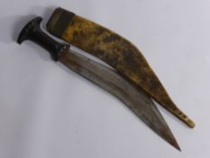 A Vintage Middle Eastern Dagger, the dagger having wooden hilt with vellum scabbard, blade length