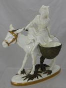 A Porcelain Figure of a Girl Riding Side Saddle on a Donkey, by Moore, impressed marks to base,