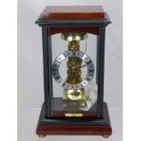 Franz Hermle "Rapport" Reproduction Skeleton Clock in glass ebonised case, approx 33 x 20 cms.