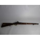 An Antique Musket, the musket having Enfield engraved to side, brass barrel approx 52 cms.