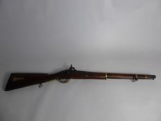 An Antique Musket, the musket having Enfield engraved to side, brass barrel approx 52 cms.