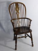 An Antique Oak Fireside Windsor Chair.