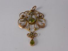 An Edwardian 9 Ct Gold Seed Pearl and Peridot Pendant, peridot 5 mm dia, approx wt 9.3 gms.