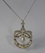 A Vintage 18 Ct Yellow Gold and Platinum Diamond and Pearl Pendant, the pendant having a bow form