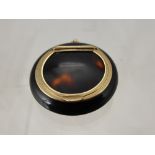 A 9 ct Gold Mounted Tortoise Shell Miniature Compact with chain loop to top, approx 5 cms long.