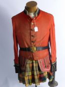 A Mannequin with Part Scottish Drummer's Jacket, together with naval officer's gilt belt and buckle,