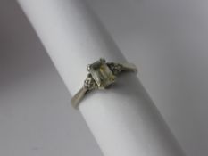 A Lady's 9 Ct White Gold Aquamarine and Diamond Ring, approx 9 pts dias,  aqua 6 x 4 mm, size O,
