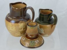 Two Doulton Lambeth Ware Pottery Jugs, including a Poole & Anderson 'Old Scotch Whisky' Jug approx