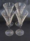 Four Large Champagne Cut Glass Flutes. (WF)