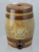 A Stone Ware Gin Barrel, with an embossed Coat of Arms, approx 26 cms high together with a Ridgway