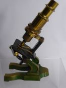 A Vintage Brass Turret Form Microscope.