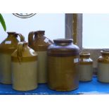 A Quantity of Vintage Pottery Flagon's, of local interest together with three preserving jars.