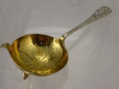 A Silver Tea Strainer, Sheffield hallmark dd 1920, mm F.H. & F.H., with gilded bowl, approx wt 48