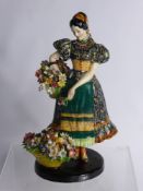 An Italian Porcelain Figurine, depicting a flower seller, approx 35 cms