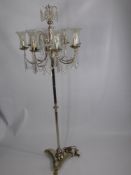 A Silvered and Cut Glass Lamp Stand, the lamp stand having cut glass droplets to centre with eight