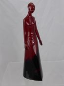 A Royal Doulton Flambe Figurine of a young woman, approx 32 cms high. (af)