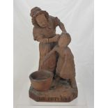 An Antique Black Forest Wooden Carving, the advertising sculpture entitled 'You Dirty Boy' signed