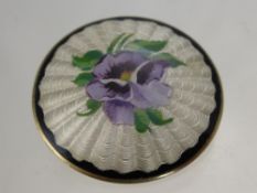 A Vintage Disc Form Continental solid silver and enamel brooch depicting a pansy, the brooch