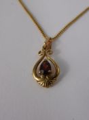 A Lady's 9 Ct Gold and Garnet Pendant and Chain, garnet 6 x 4 mm,  total approx wt 2.8 gms.