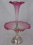 An Edwardian Opaque Cranberry Glass and Continental Silver Epergne, with gilt highlights. The