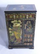 A Chinese Style Lacquered Chest, the chest depicting birds and having split front door with cupboard