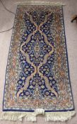 Two Oriental Woollen Rugs, one approx 160 x 108 cms, the other 155 x 73 cms.