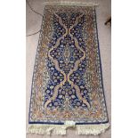 Two Oriental Woollen Rugs, one approx 160 x 108 cms, the other 155 x 73 cms.