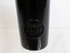 A 19th Century Black Glass Sealed Wine Bottle, the seal stamped Rousdon Jubilee and dated 1887.