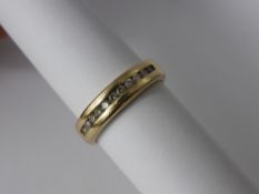 A Lady's 14 Ct Yellow Gold and Diamond Half Eternity Ring, the ring channel set with 11 dias, approx