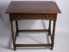 An Antique Oak Table, the table having carved front with turned legs on stretchers, approx 55 x 63