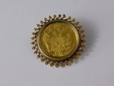 An Austrian Gold Ducat, in a 14 ct gold mount.