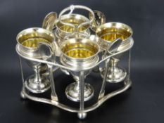 A Silver Egg Cup Set and Stand, comprising four egg cups Birmingham hallmark dd 1805, four spoons of