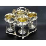 A Silver Egg Cup Set and Stand, comprising four egg cups Birmingham hallmark dd 1805, four spoons of