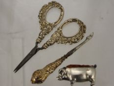 A Silver Metal Pin Cushion in the form of a pig, together with a silver handled needlework