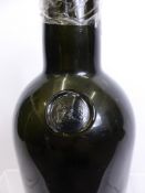 A large 19th Century Green Glass Sealed Wine Bottle, the bottle with remnants of contents the seal