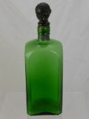 A Large Vintage Green Glass Decanter, with the stopper in the form of a man's head.