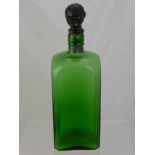 A Large Vintage Green Glass Decanter, with the stopper in the form of a man's head.