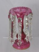 A Victorian Cranberry Glass Table Lustre, with cut glass drops, approx 26 cms high.