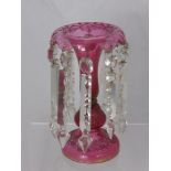 A Victorian Cranberry Glass Table Lustre, with cut glass drops, approx 26 cms high.