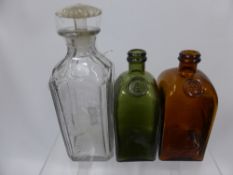 Two Vintage Coloured Glass Decanters, together with a cut glass decanter for 'The Bushmills