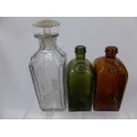 Two Vintage Coloured Glass Decanters, together with a cut glass decanter for 'The Bushmills