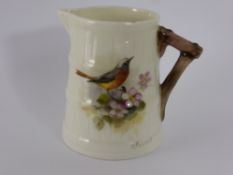 A Royal Worcester Hand Painted Miniature Jug, depicting a wild rose and signed N. Powell.