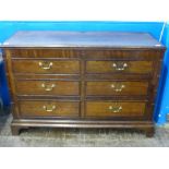 A Georgian Oak Mule Chest with six graduated drawers (two dummy), a hinged lid reveals a fitted