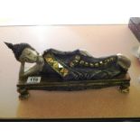 THAI FIGURE LYING ON PLINTH