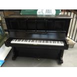 Bechstein C.1902 An upright piano in an ebonised case.