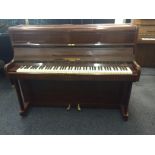 Brinsmead     C.1937 An upright piano in a mahogany case.